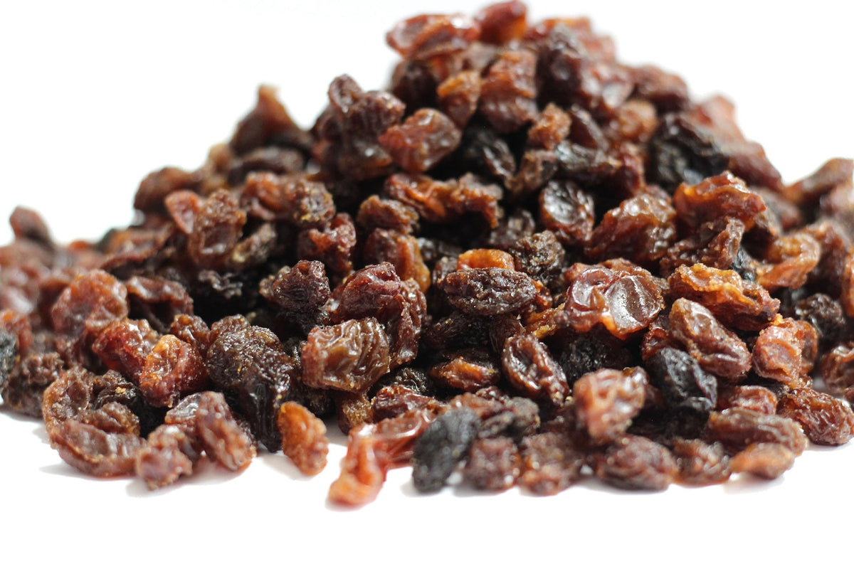 Black Raisins, whole dark wrinkled raisins in a loose pile
