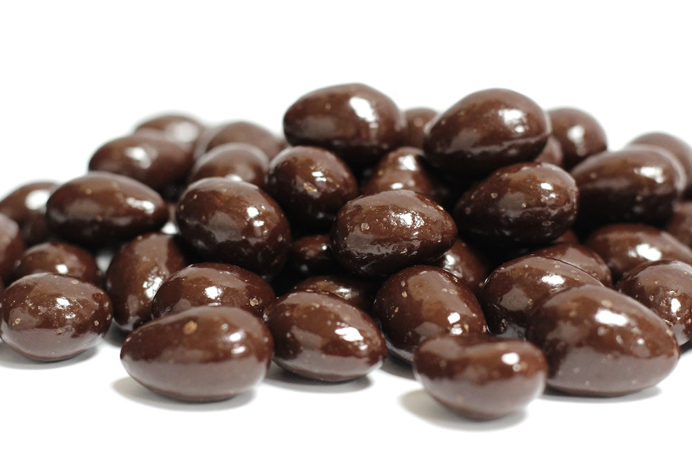 Dark Chocolate Almonds, whole almonds coated in dark chocolate in a loose heap
