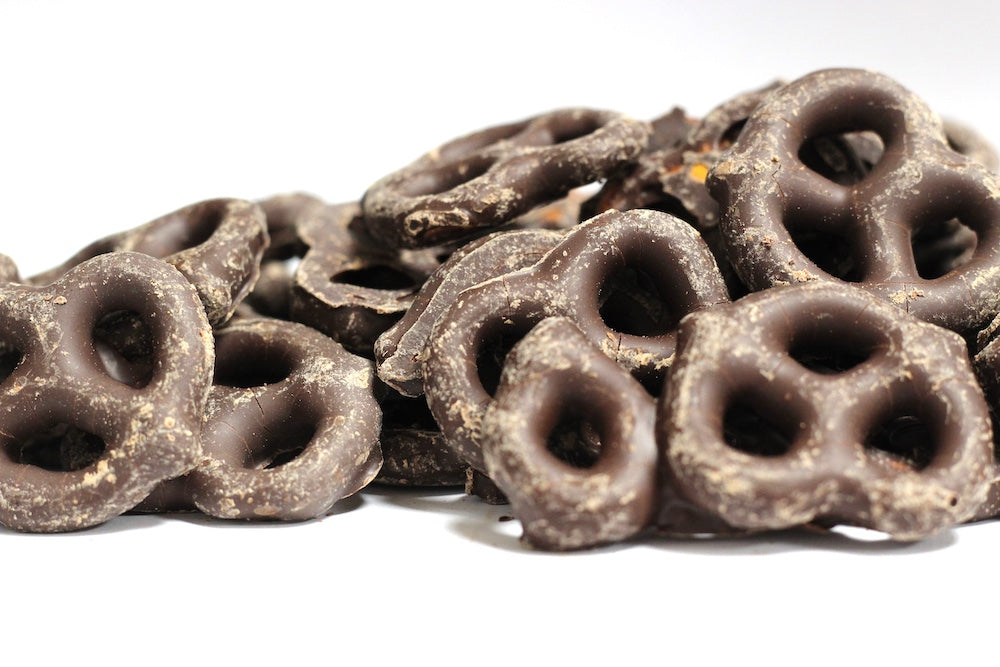 Dark Chocolate Pretzels, whole twisted pretzels coated in dark chocolate in a loose pile