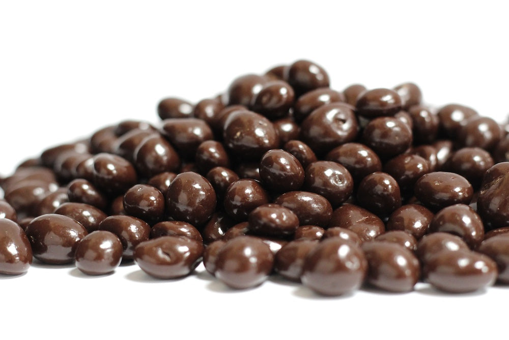Dark Chocolate Raisins, whole raisins coated in dark chocolate in a loose pile