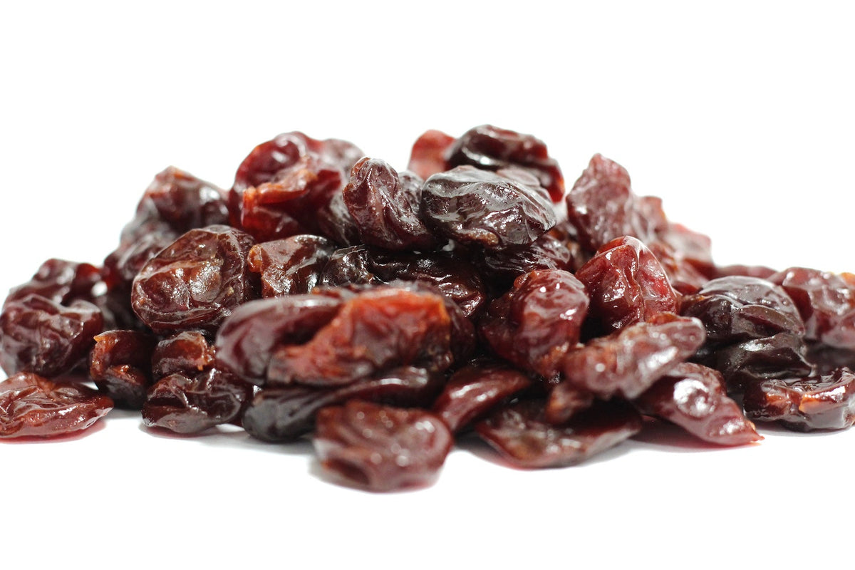 Dried Cherries, whole wrinkled fruit pieces in deep red and burgundy tones in a loose pile