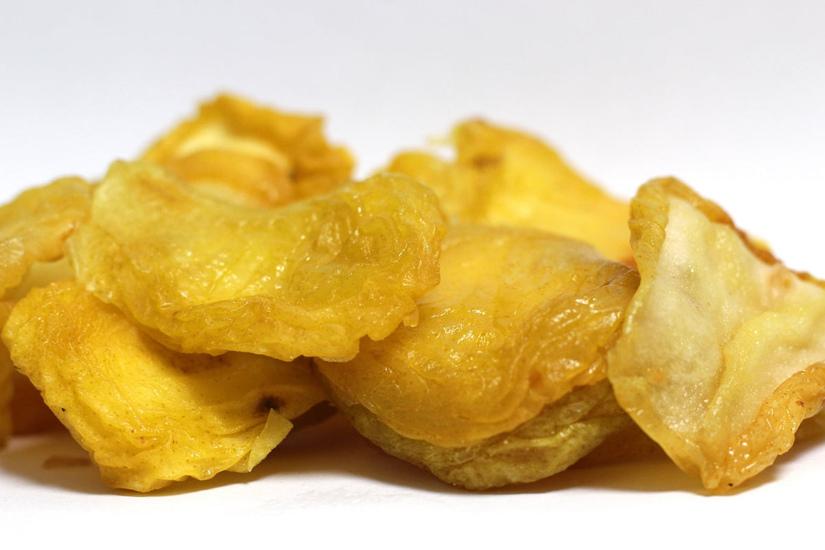 Jumbo Pears, large dried pear halves with golden, translucent edges in a loose heap