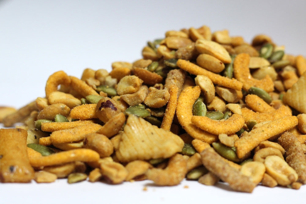 Far East Treats loose heap of whole peanuts, cashews, green pepitas and sesame sticks