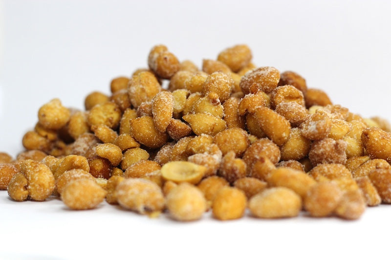 Honey Roasted Peanuts, whole and halved peanuts with a light golden honey coating in a loose heap