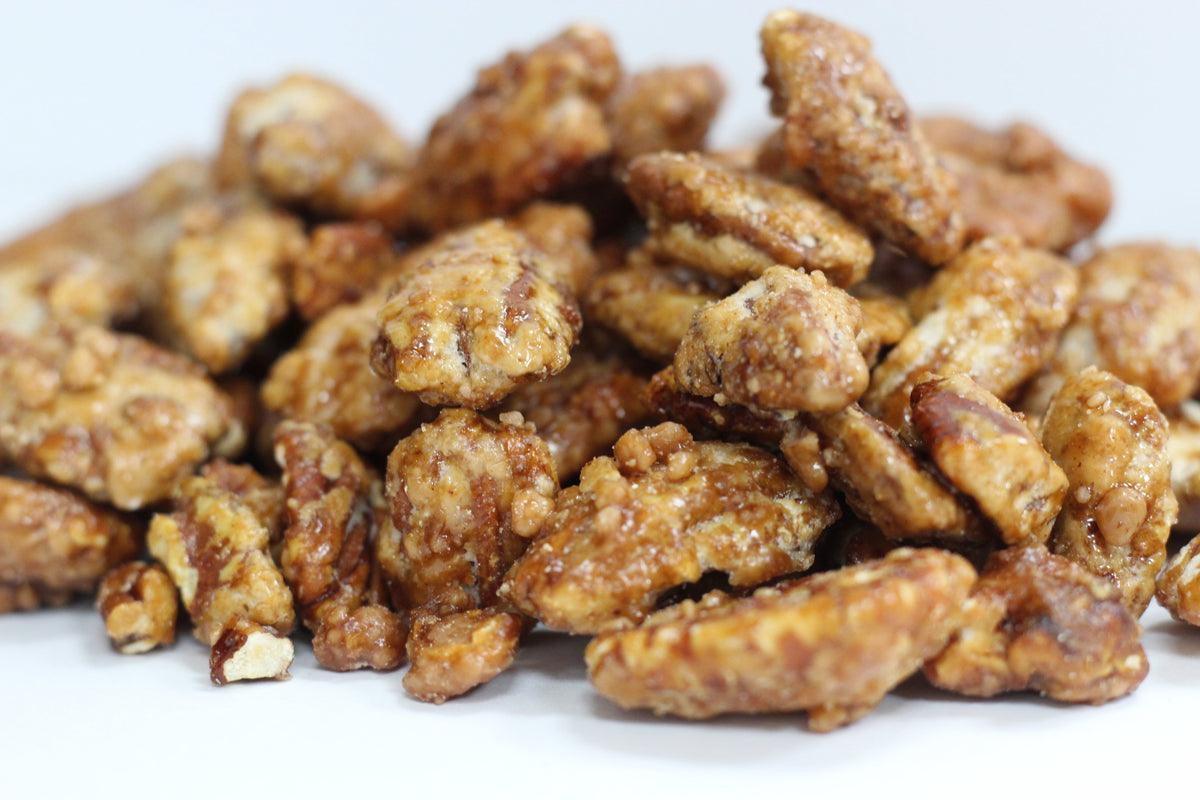 Butter Toffee Pecans: whole pecans with golden toffee coating in a loose heap