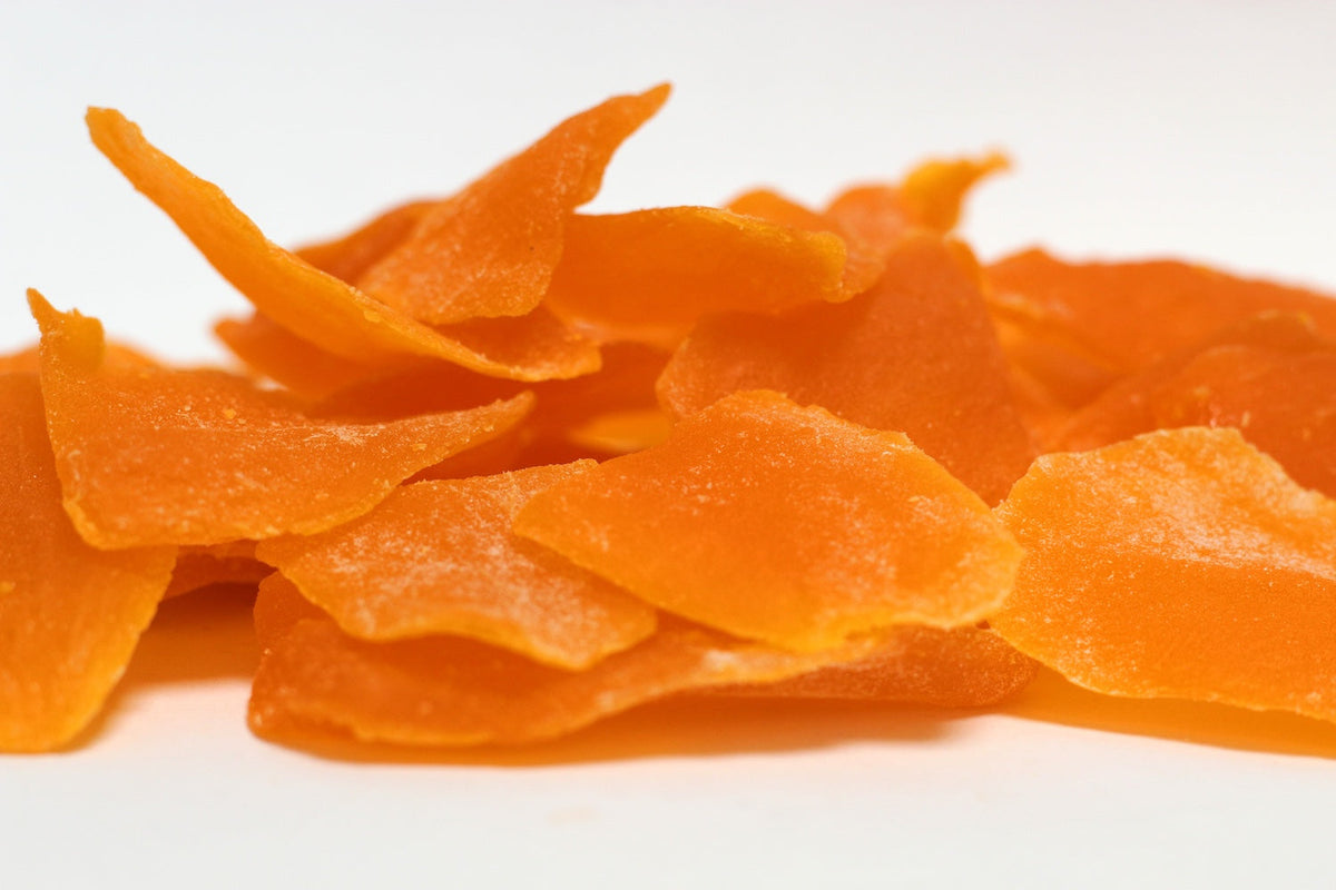 Mango Slices in a loose heap of curved, golden-orange fruit slices