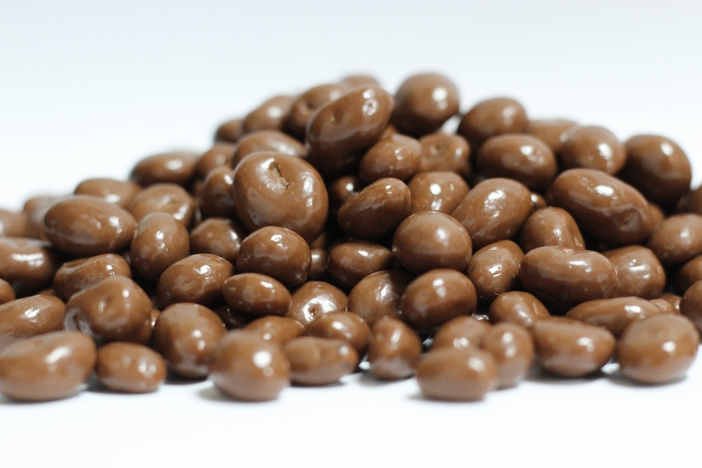 Milk Chocolate Raisins, whole raisins coated in milk chocolate in a loose heap