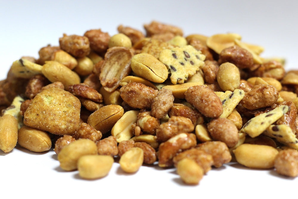 Party Hearty snack mix, a loose heap of peanuts, crunchy snack pieces and crackers in varied shapes