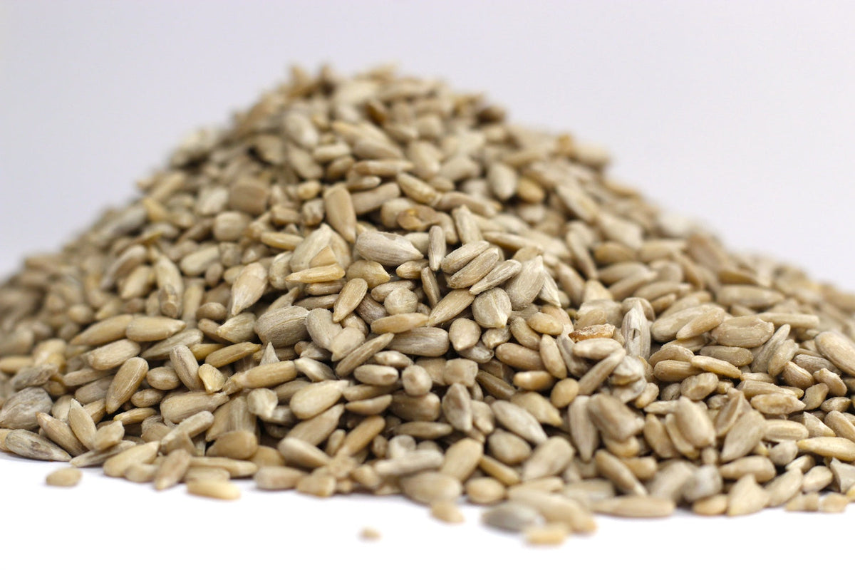 Raw Sunflower Seeds, whole pale cream sunflower kernels in a loose heap