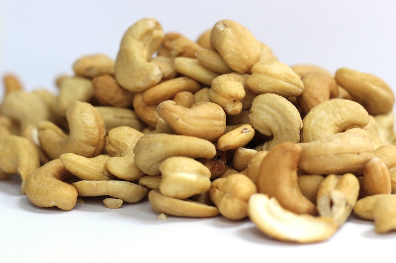 Roasted, No Salt Cashews, whole and halved cashews in a loose pile