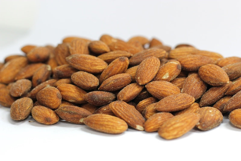 Roasted, Salted Almonds: whole roasted almonds with a light coating of salt in a loose pile