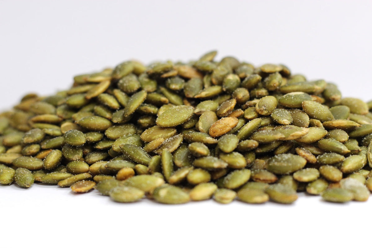 Roasted, Salted Pepitas, whole green pepitas with a lightly salted roasted surface in a loose heap