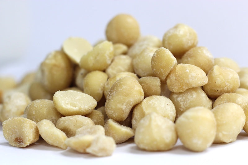 Roasted, Salted Macadamia Nuts whole, rounded nuts with lightly browned roasted surfaces in a loose pile
