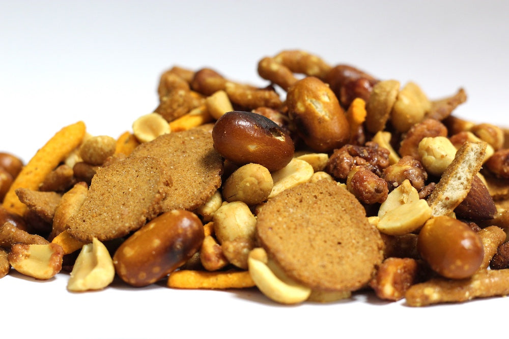 Signature Mix with whole roasted peanuts, pretzel nuggets, sesame sticks and rye chips in a loose heap