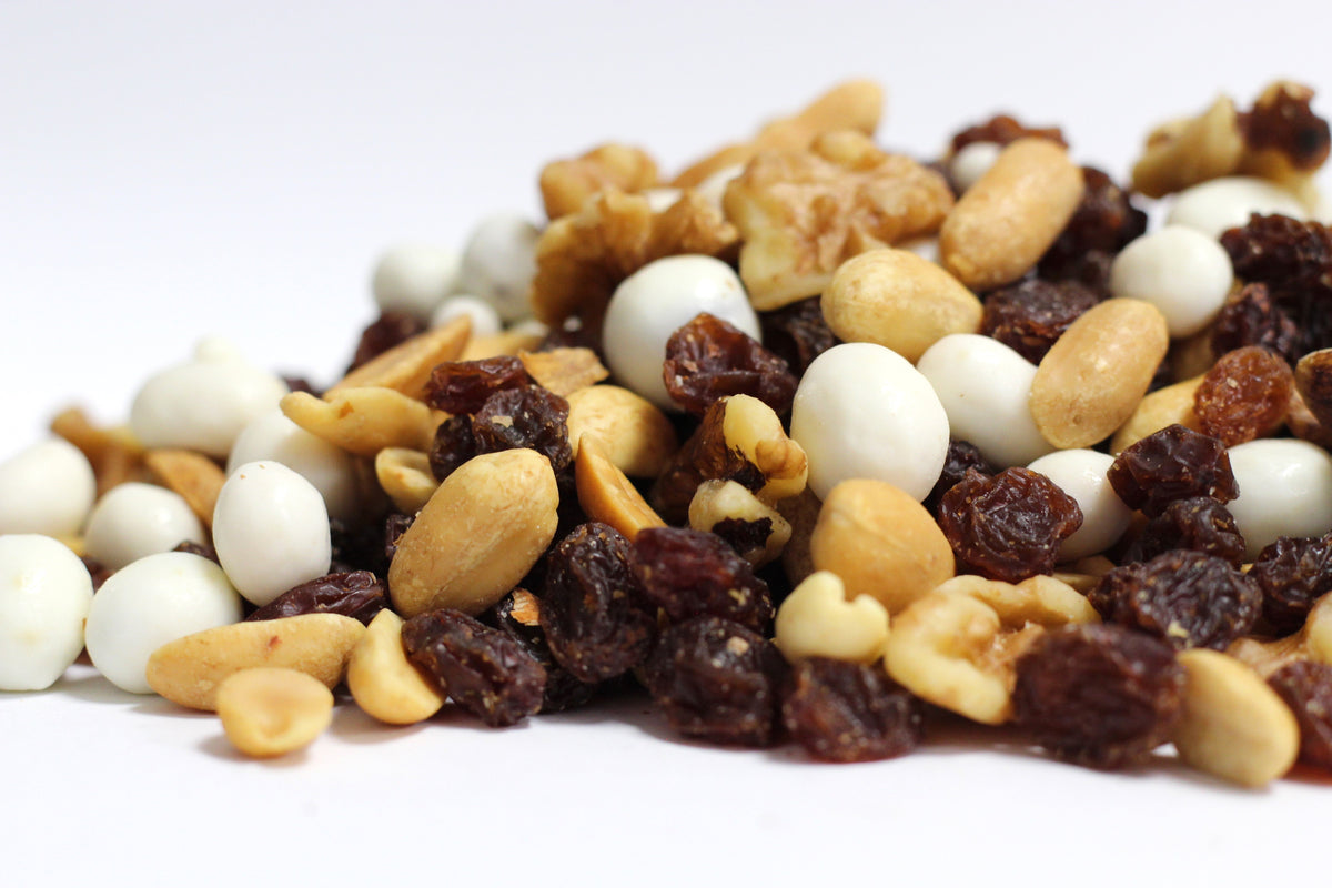 Yogurt Nut Trek: loose heap of creamy yogurt-coated pieces with whole raisins, roasted peanuts, and walnut halves
